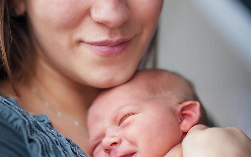 Nurse caring for newborn